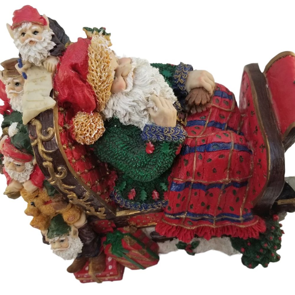Santa in a Red Sleight Bed Resin Holiday Décor with Elves, Presents, And Toys - Picture 11 of 15
